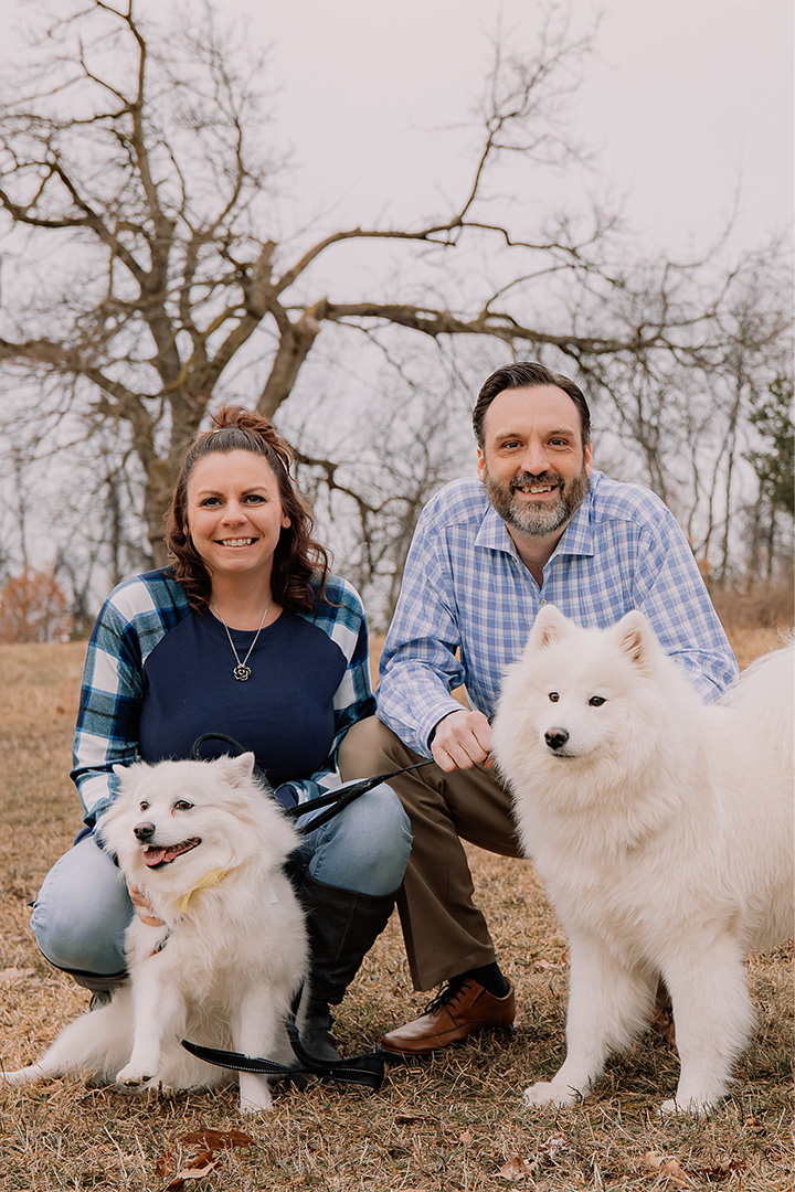 Jon Wian with his wife and two dogs outside