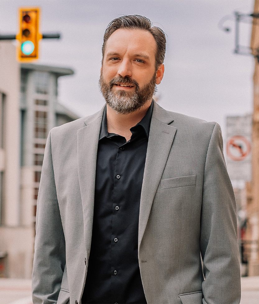 Professional headshot of Jon Wian outside